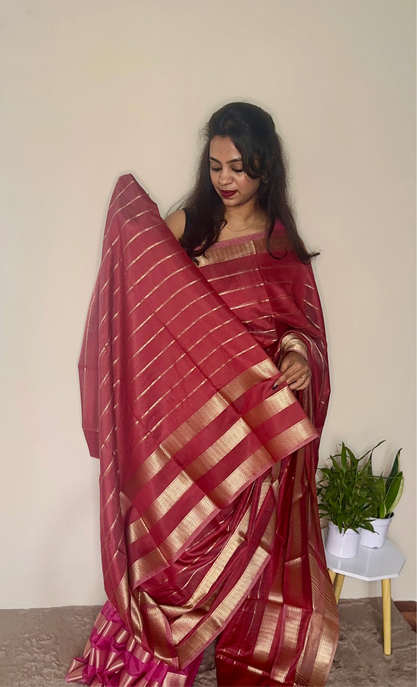 Model wearing a Maroon soft cotton saree with gold zari detailing, styled for festive wear – Jayithva