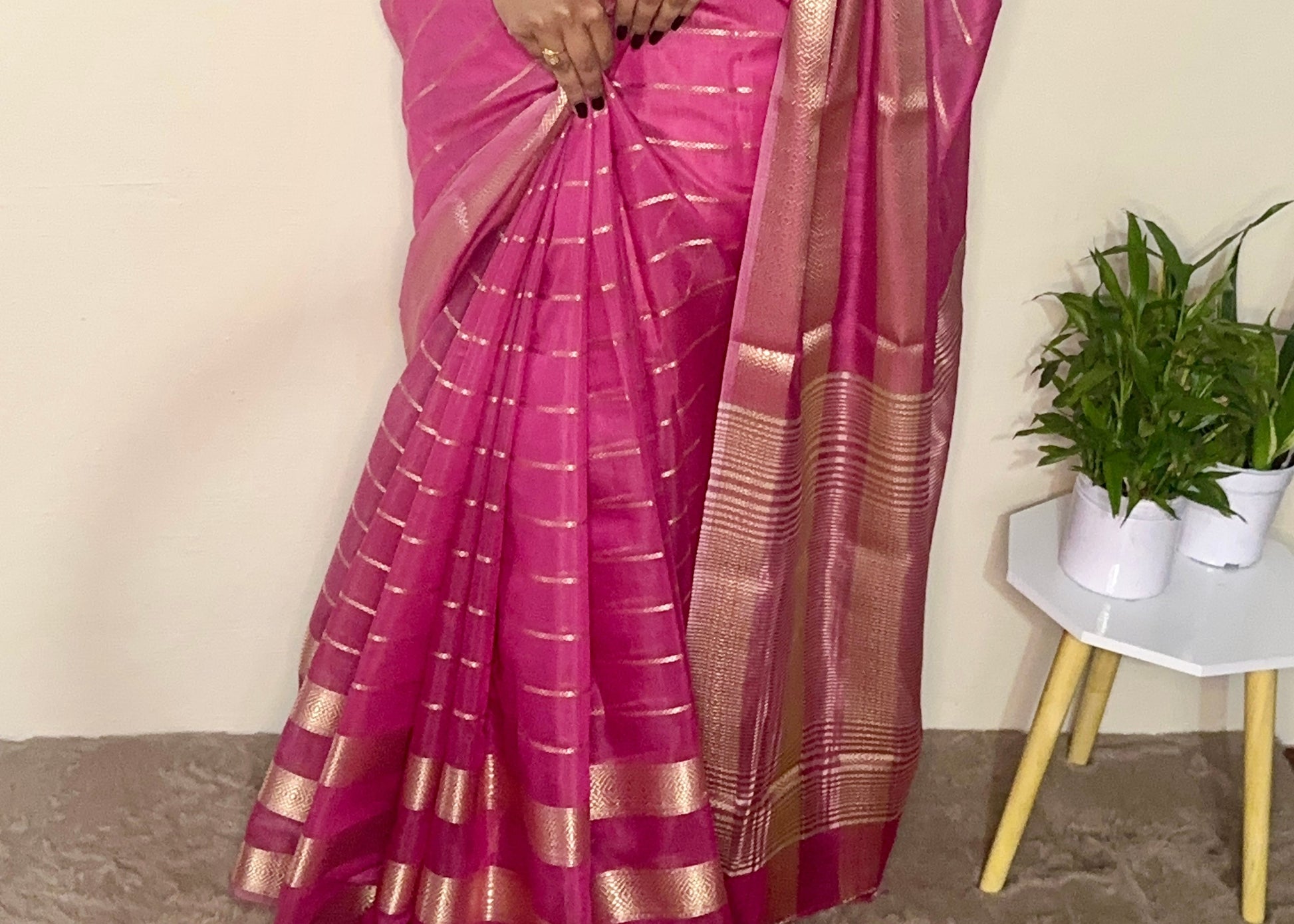 Model wearing a Pink soft cotton saree with gold zari detailing, styled for festive wear – Jayithva