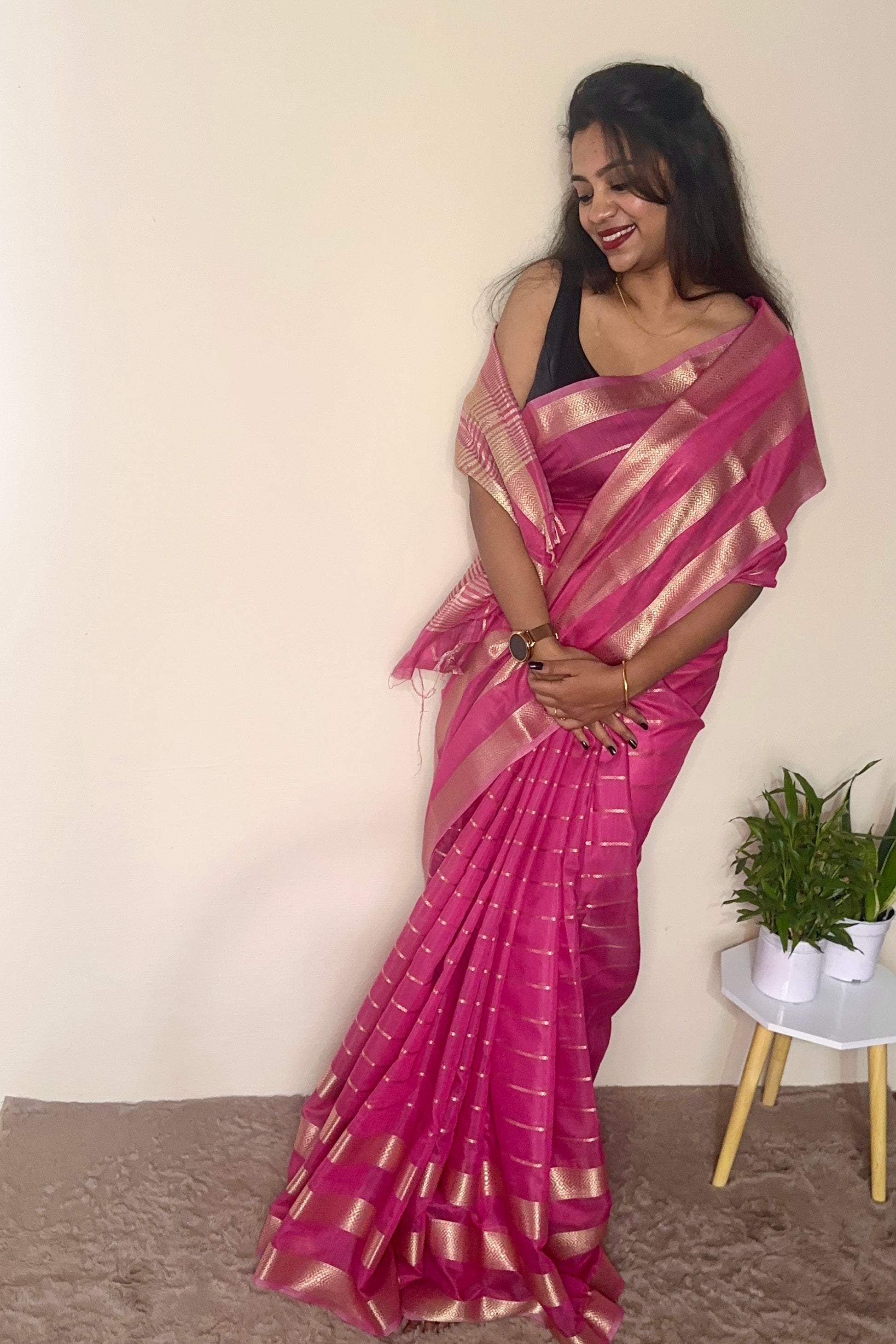 Model wearing a Pink soft cotton saree with gold zari detailing, styled for festive wear – Jayithva