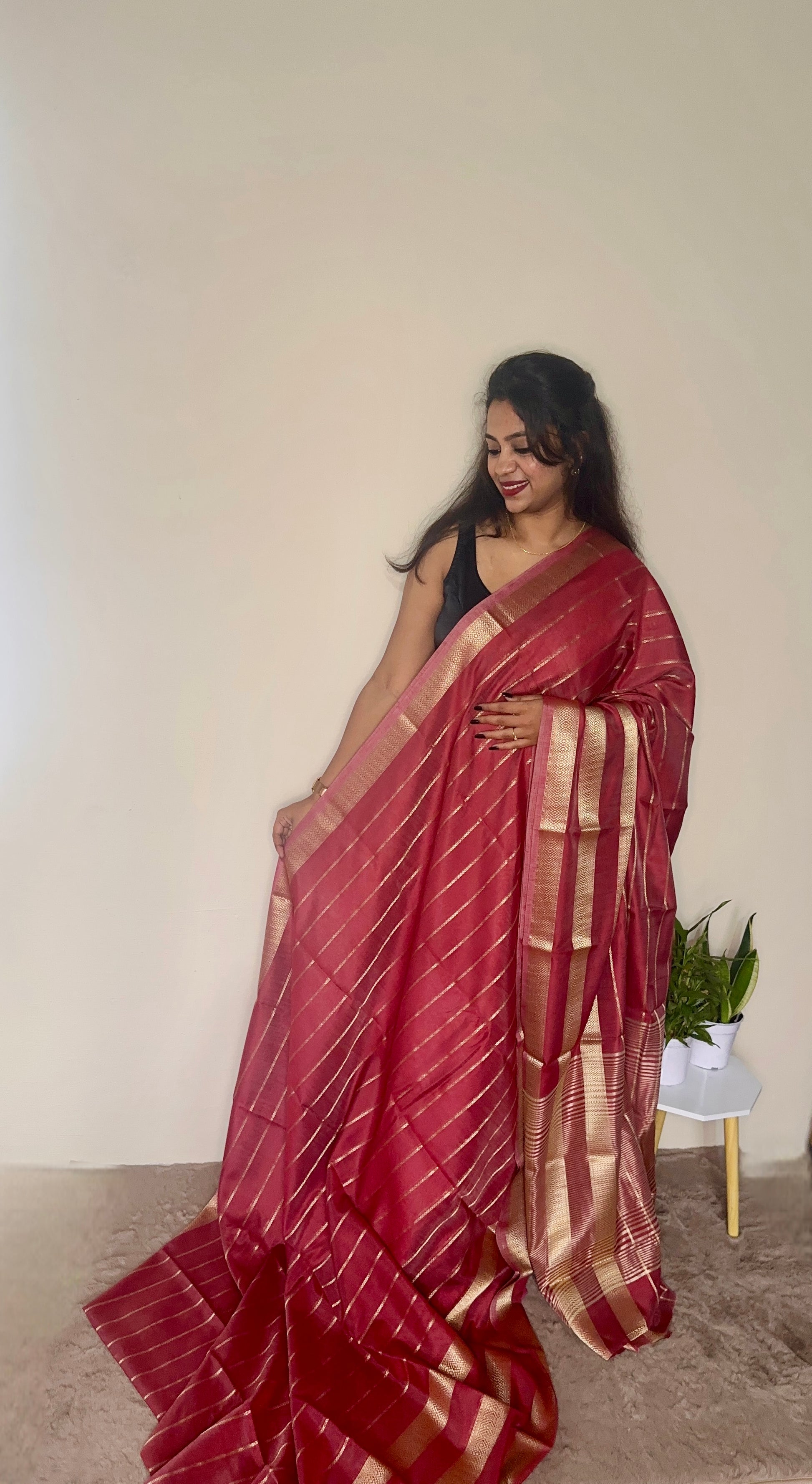 Model wearing a Maroon soft cotton saree with gold zari detailing, styled for festive wear – Jayithva