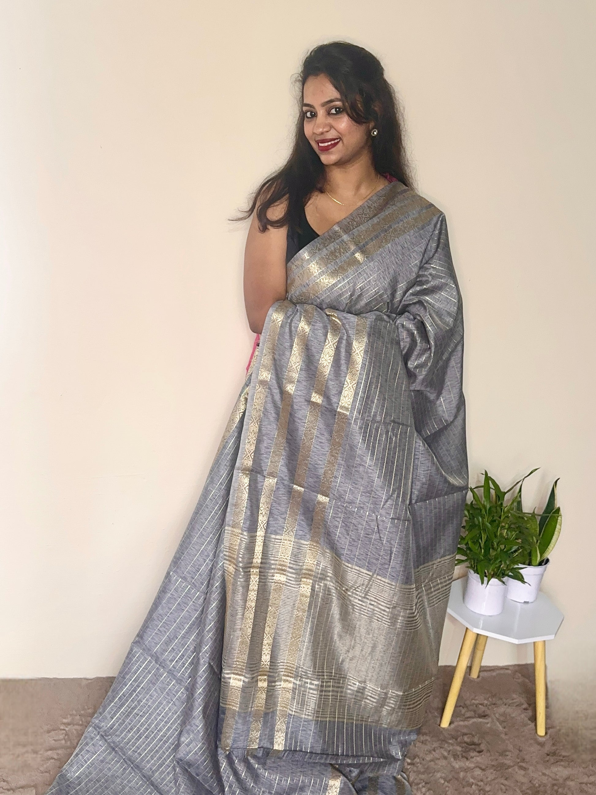 Model wearing a Grey soft cotton saree with gold zari detailing, styled for casual wear – Jayithva