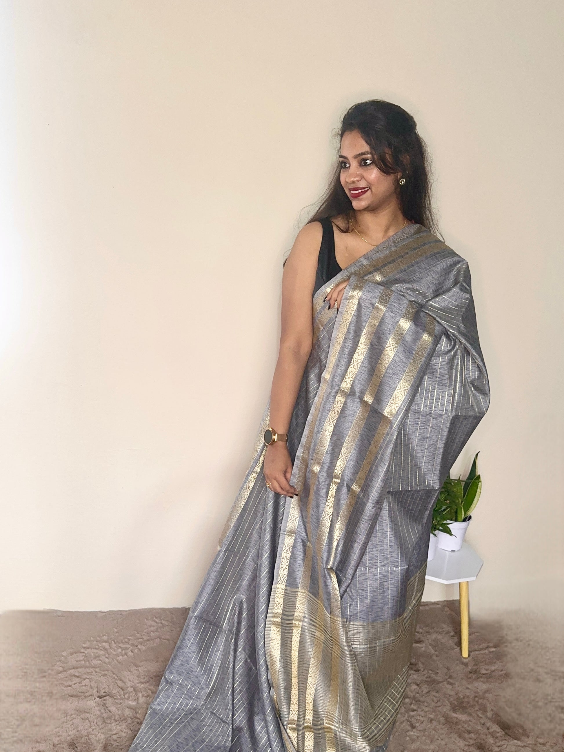 Model wearing a Grey soft cotton saree with gold zari detailing, styled for casual wear – Jayithva