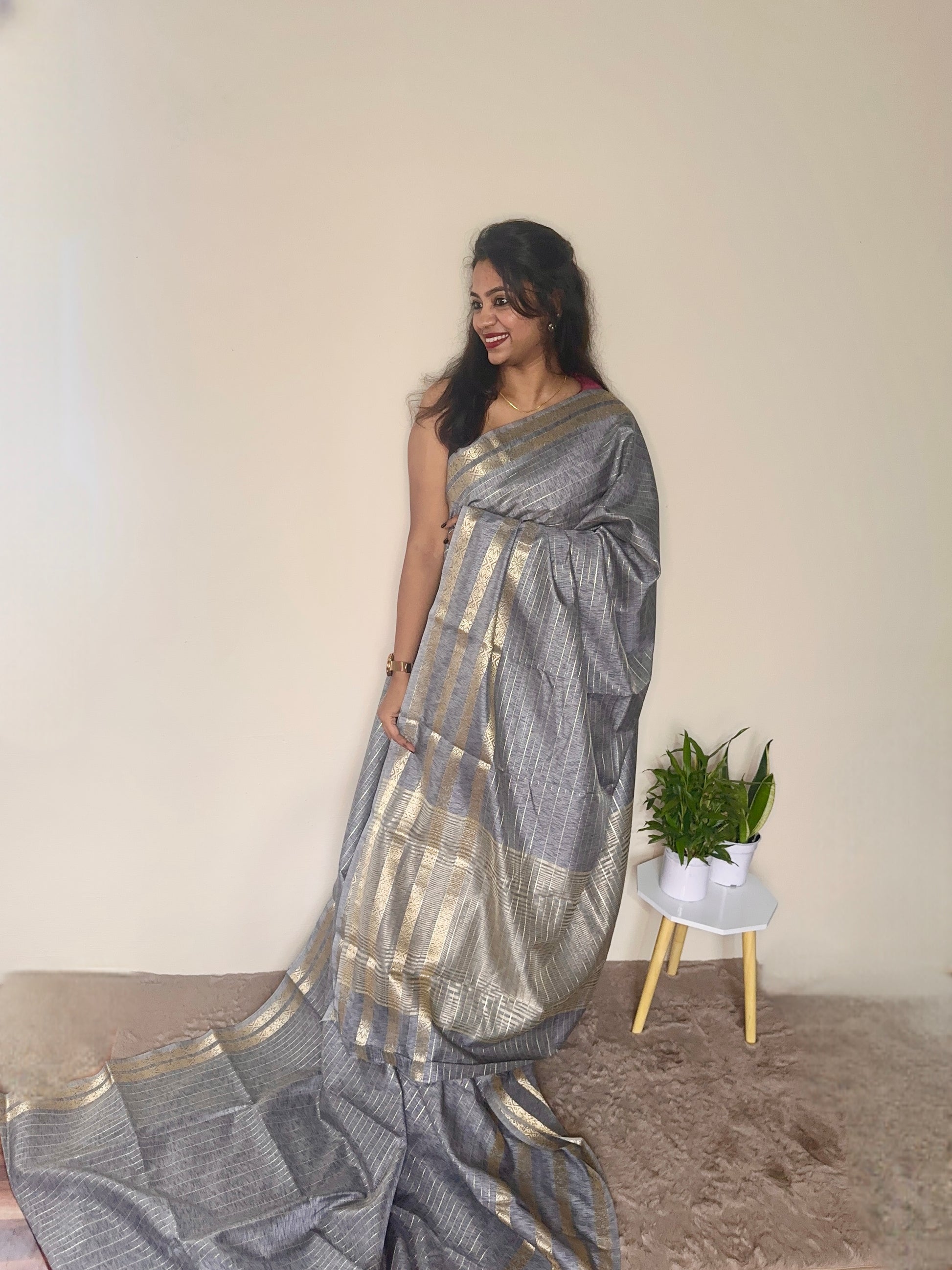 Model wearing a Grey soft cotton saree with gold zari detailing, styled for casual wear – Jayithva