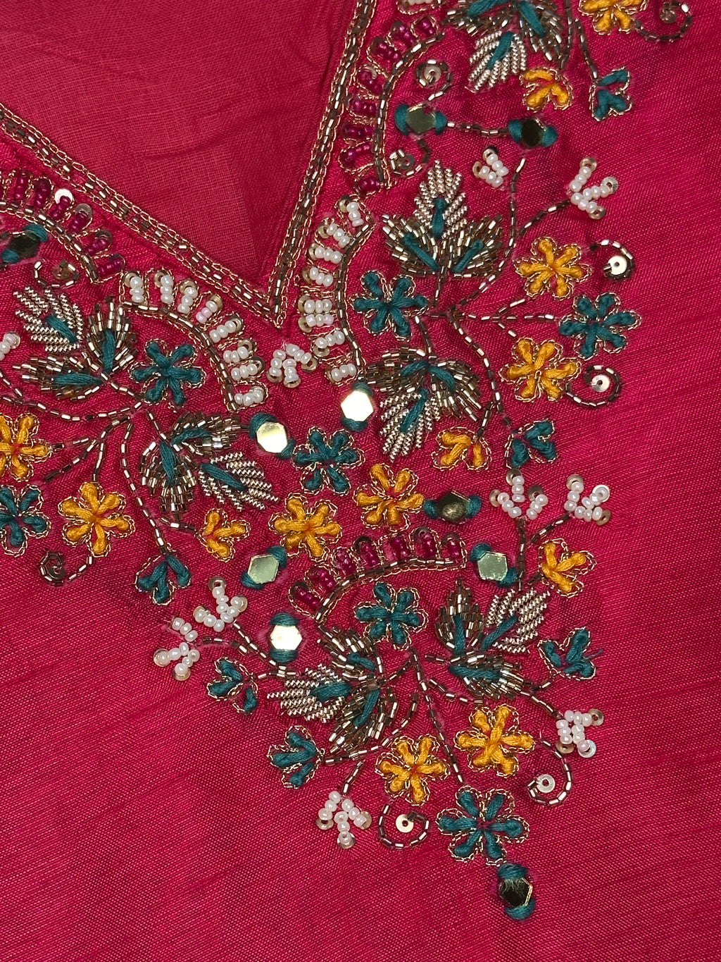 Close-up of hand embroidered neckline on pink Dola silk kurta set