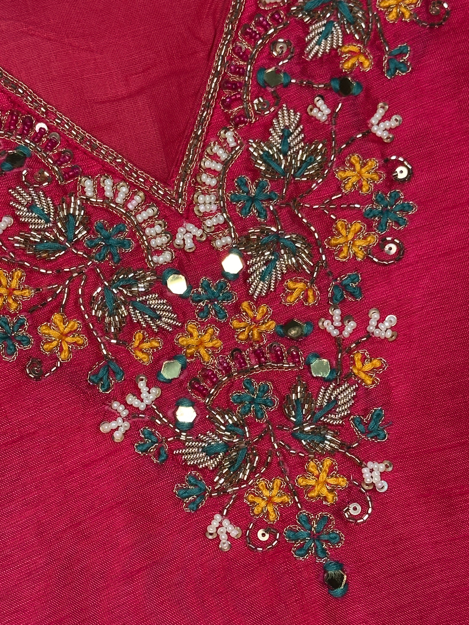 Close-up of hand embroidered neckline on pink Dola silk kurta set