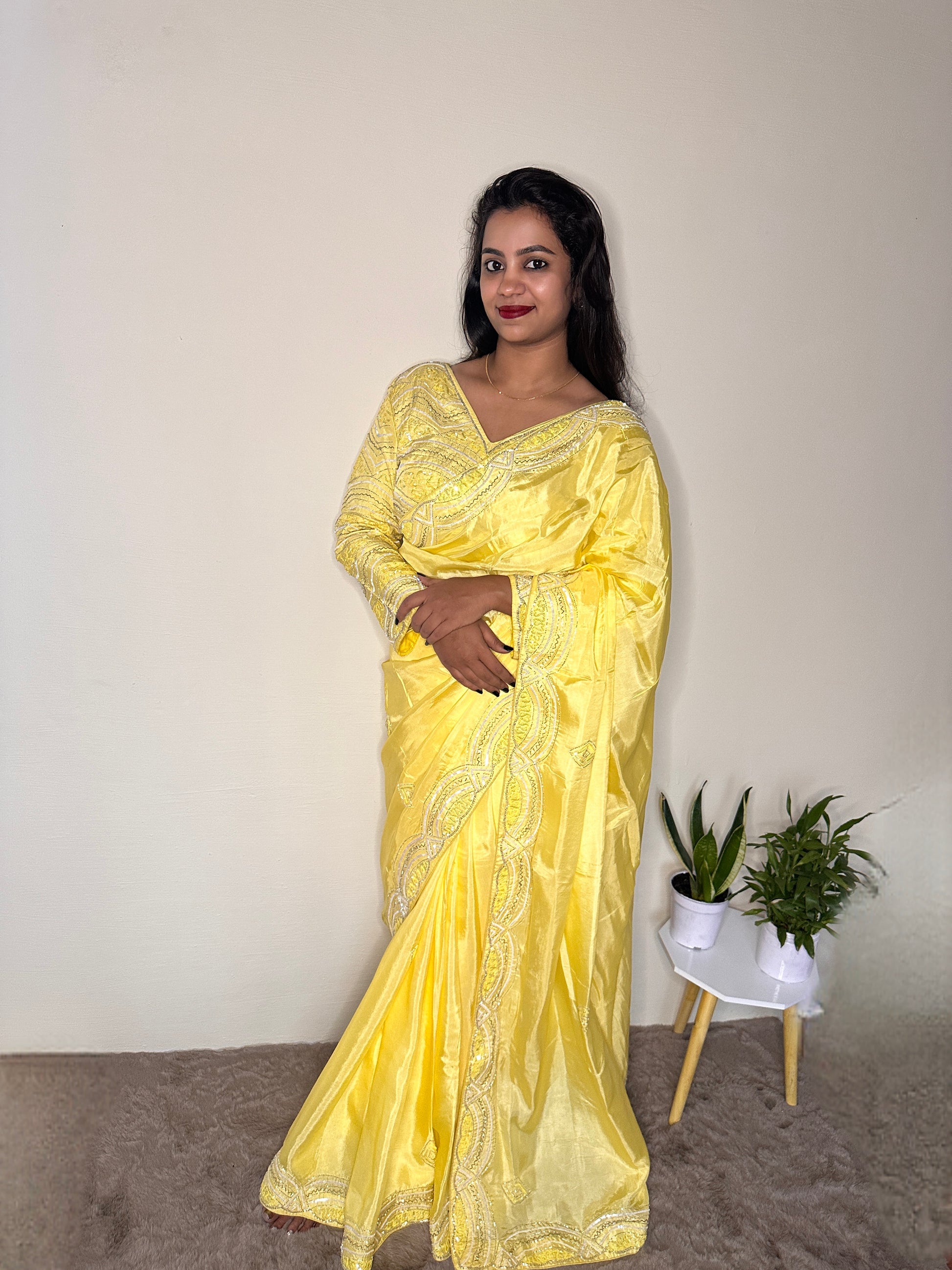 Model wearing party wear saree with stiched blouse 