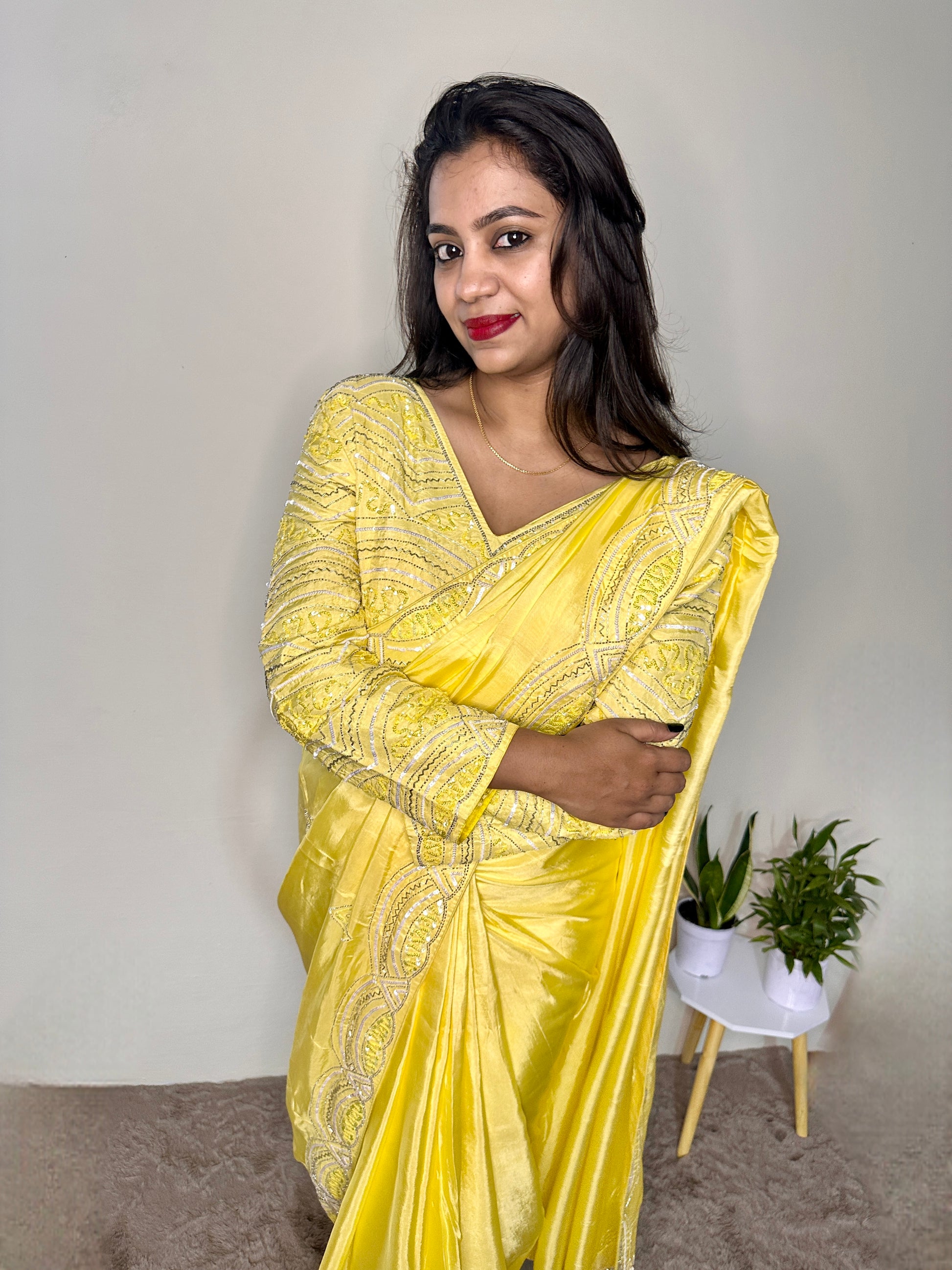 Model wearing party wear saree with stiched blouse 