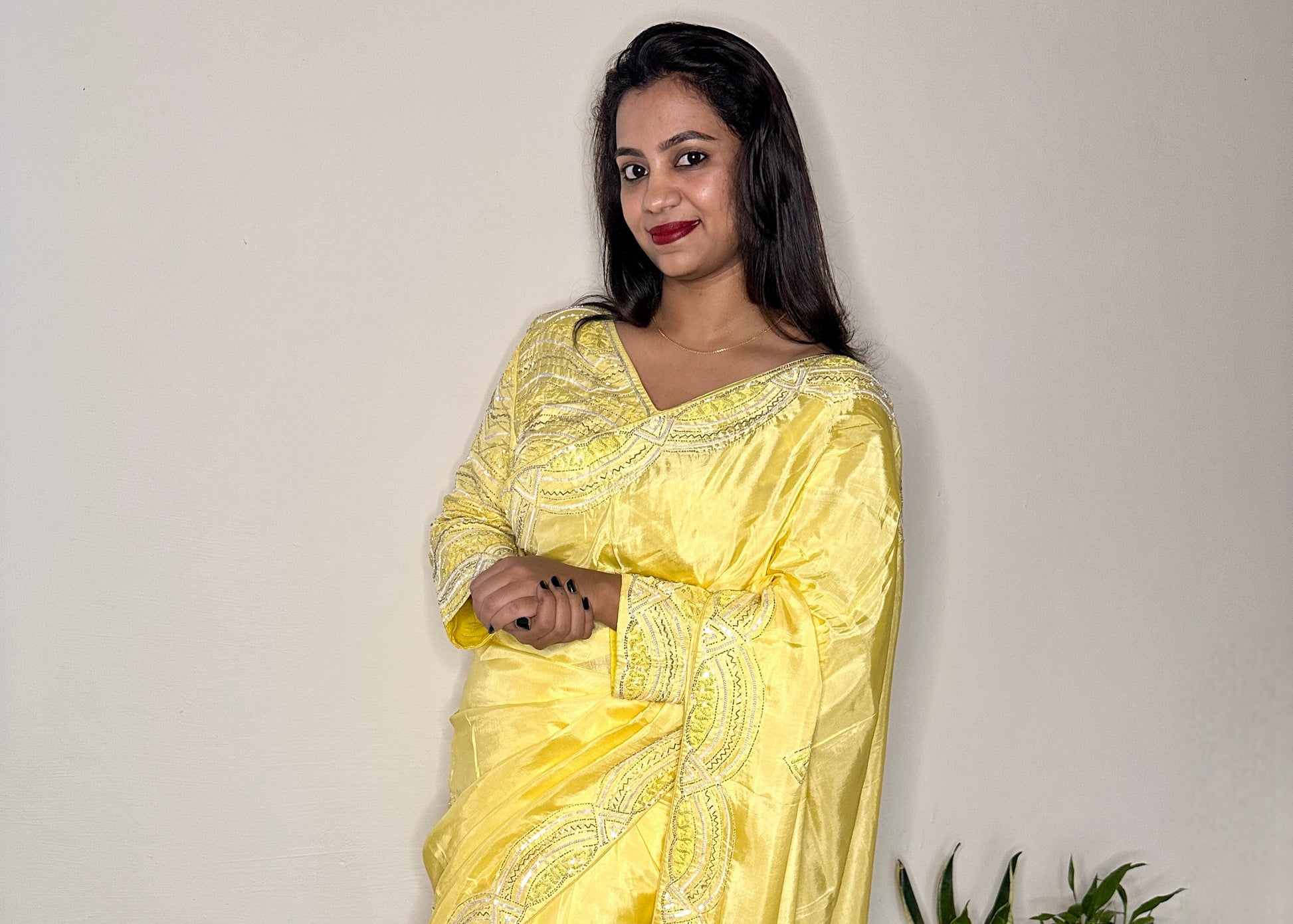 Model wearing party wear saree with stiched blouse 